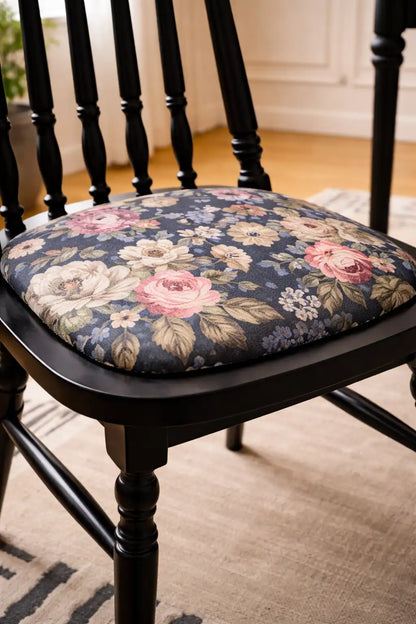 Belsize Chair close-up showing floral cotton seat cushion on black ash wood dining chair in a UK dining room