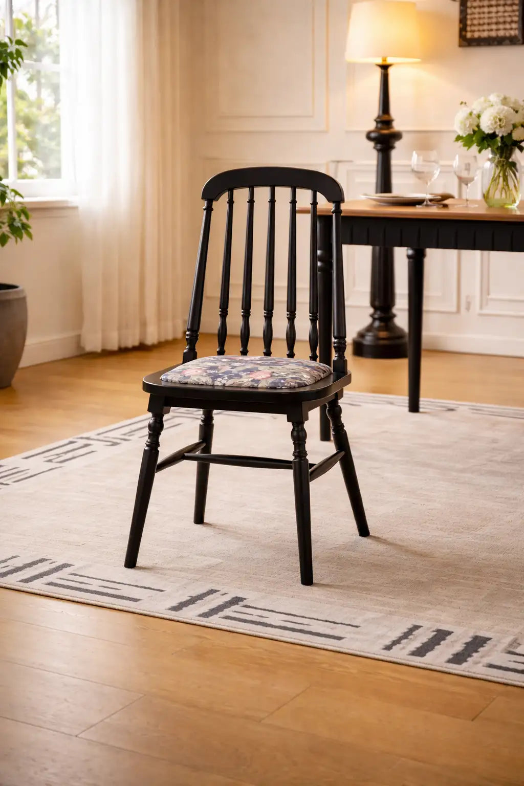 Belsize Chair black ash wood dining chair with floral cotton seat cushion in a bright UK dining room interior