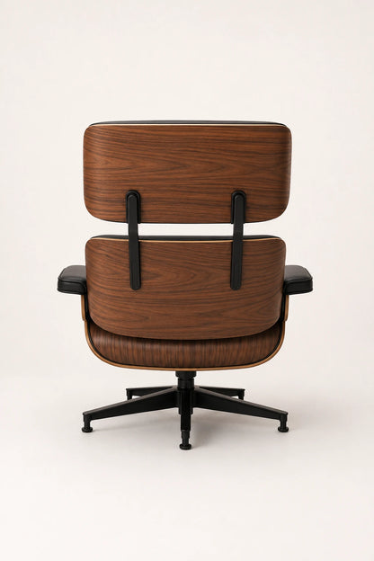 Back view of mid-century office lounge chair with walnut shell and black five-star swivel base