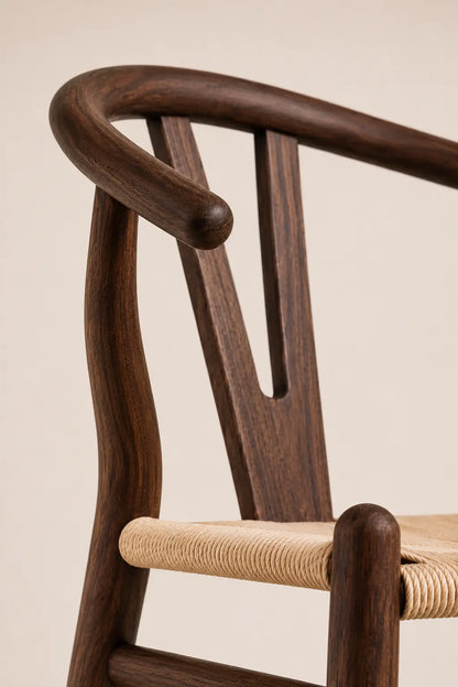 Wooden chair with curved backrest on a beige background