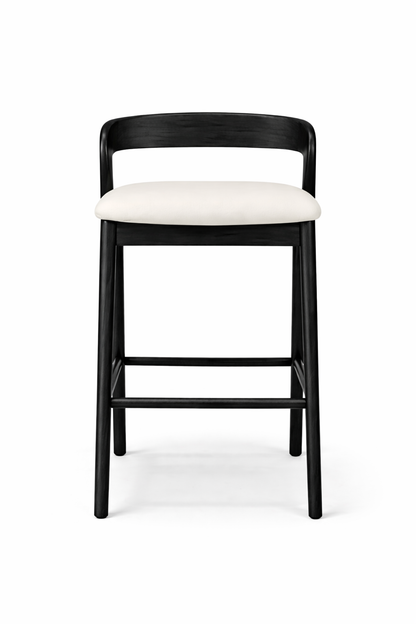 Black bar stool with a white cushion on a white background
