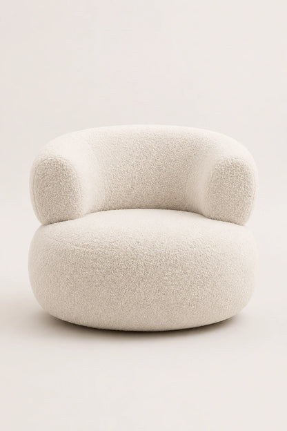 White bouclé armchair angled studio view with curved arms and rounded silhouette