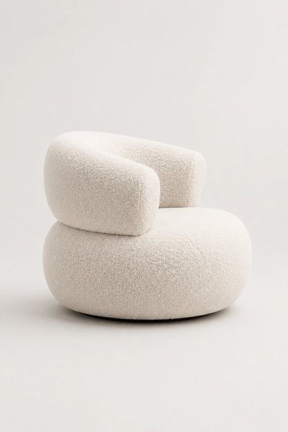 White bouclé armchair front view with rounded back and sculptural seat