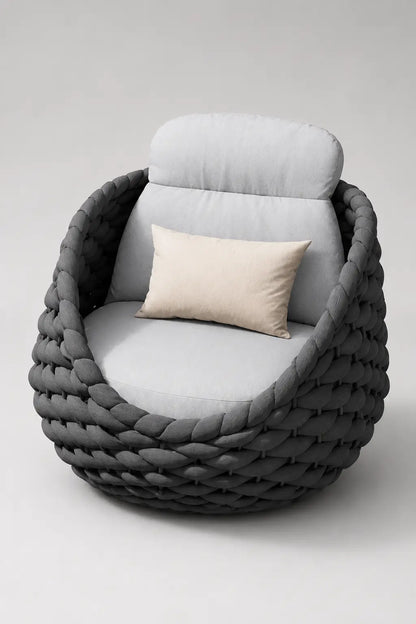 Modern chair with braided armrests and cushioned seat on a white background