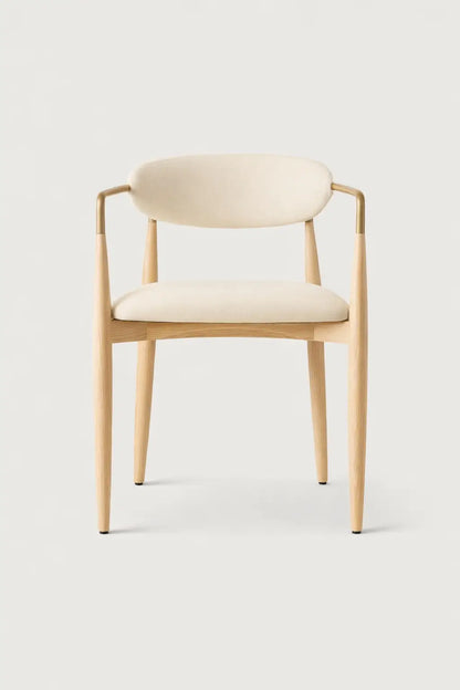 Modern ash dining chair UK front view crafted from solid ash wood with upholstered seat and brass detail.
