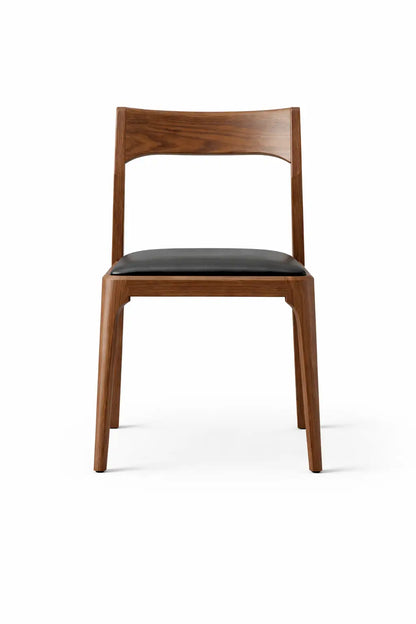 Wooden chair with black seat on a white background