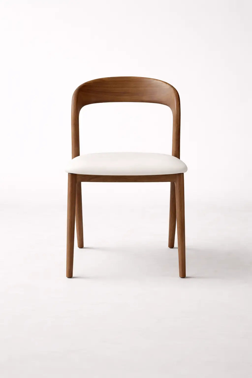 Wooden chair with a white cushion on a white background