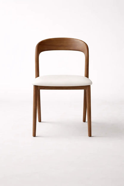 Wooden chair with a white cushion on a white background