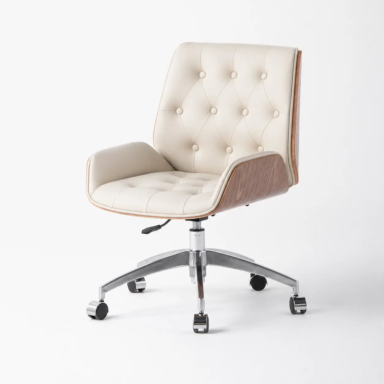 Close-up of cream executive office lounge chair with tufted upholstery, walnut arm panel, height lever and chrome wheeled base