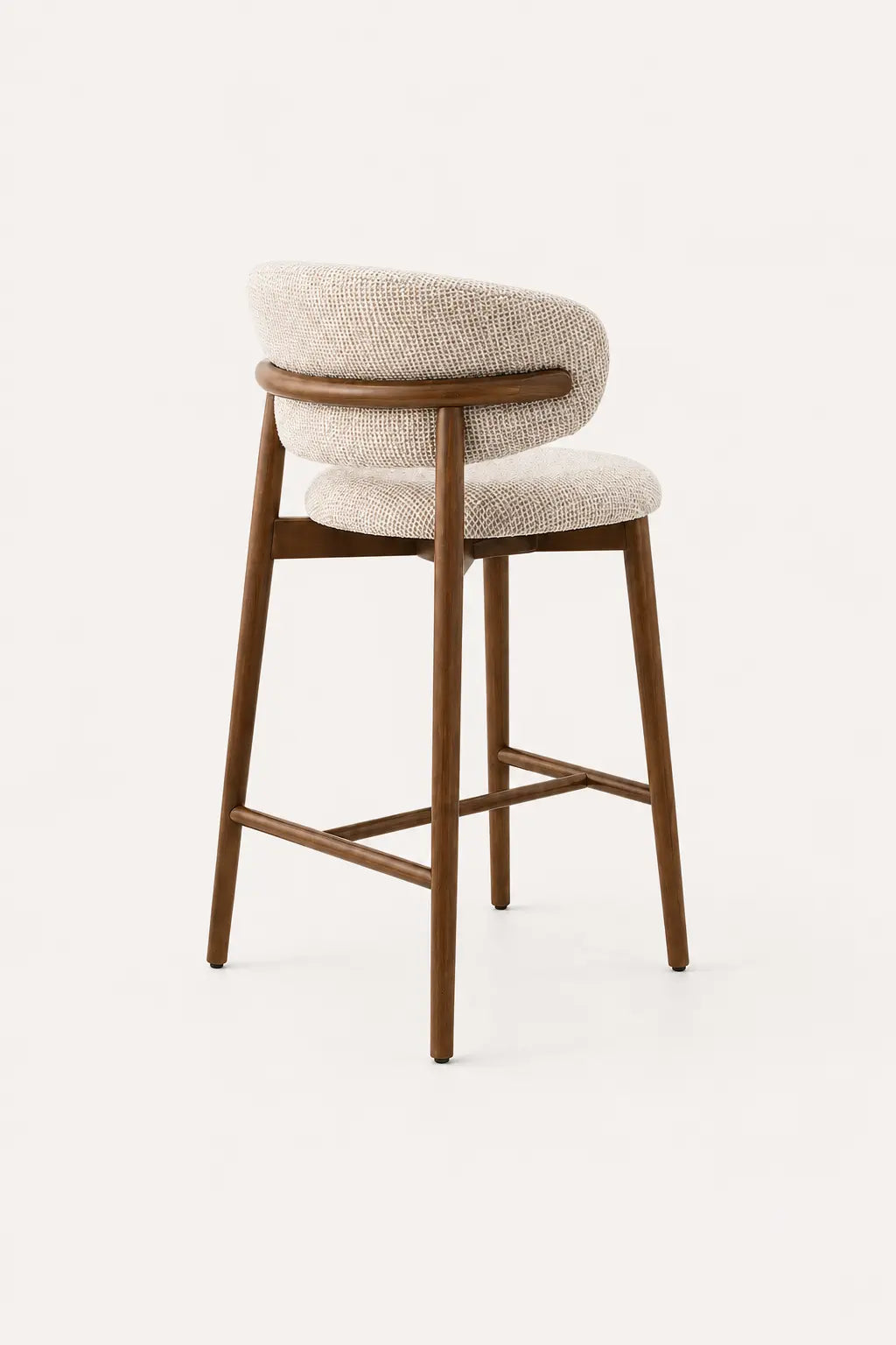 Cream upholstered bar stool with wooden legs for kitchen island seating in a contemporary home