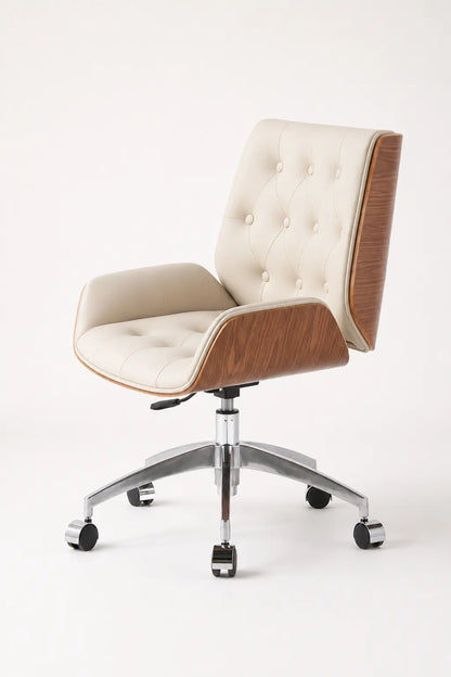 Front three-quarter view of cream mid-century office lounge chair with tufted upholstery, walnut panels and chrome wheeled base