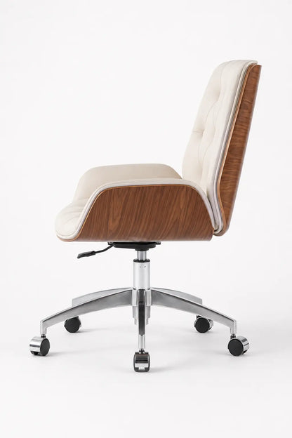 Side view of cream swivel office lounge chair showing the tall tufted backrest, curved walnut shell and chrome castor base