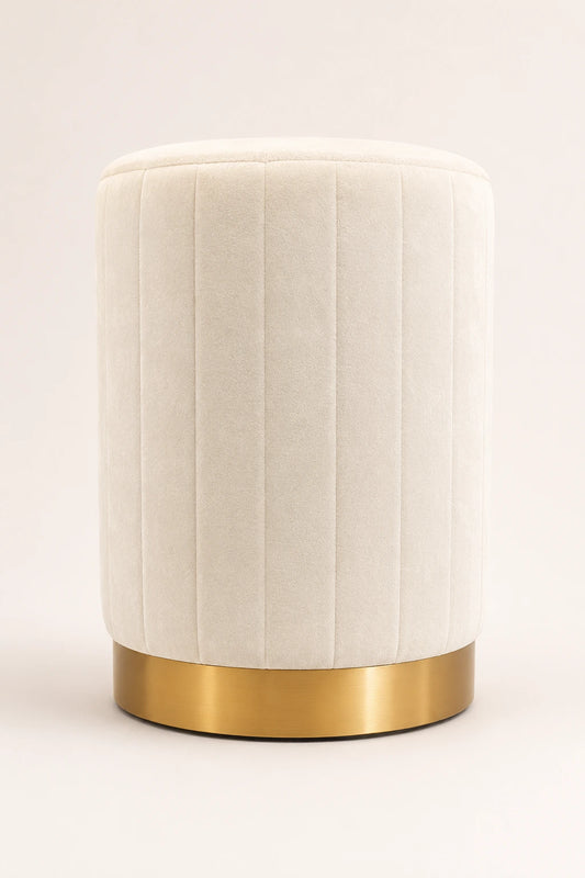 White textured cylindrical stool with a gold base on a light beige background