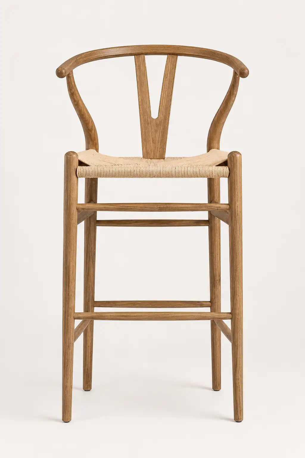 Birk mid-century wishbone dining chair with walnut-finish ash wood frame and natural rattan seat in a minimalist interior