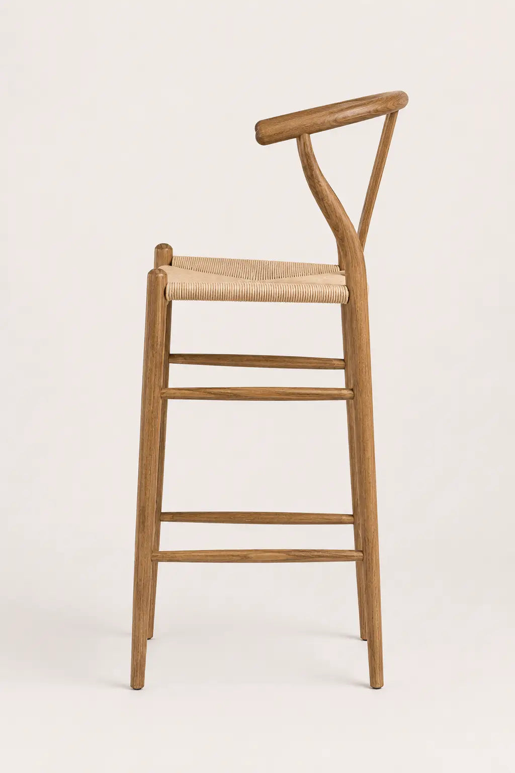 Wooden bar stool with woven seat on a white background