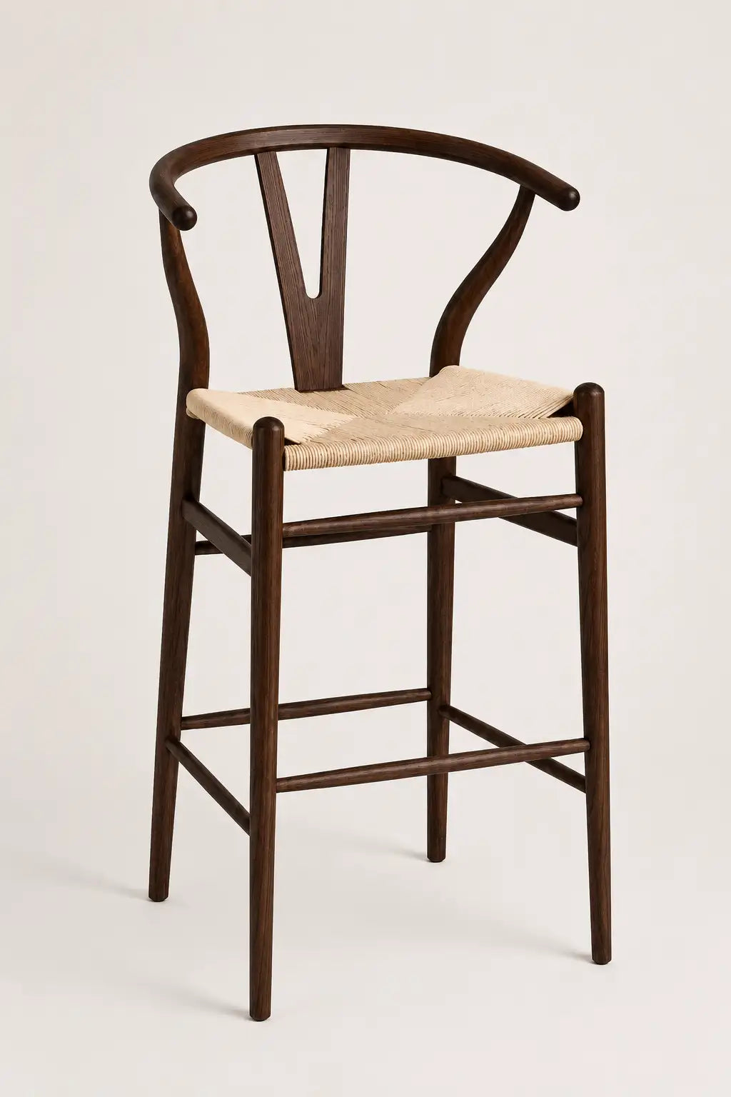 Wooden bar stool with a woven seat on a white background