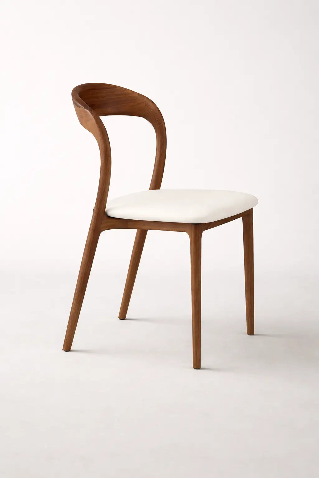 Wooden chair with a white seat on a light gray background