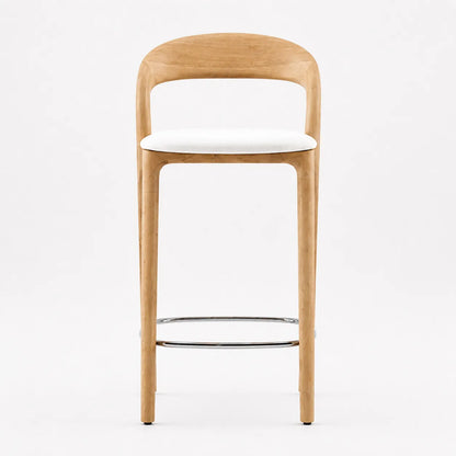 Front view of Mid-Century Southwood oak bar stool with white upholstered seat, curved wooden back and chrome footrest