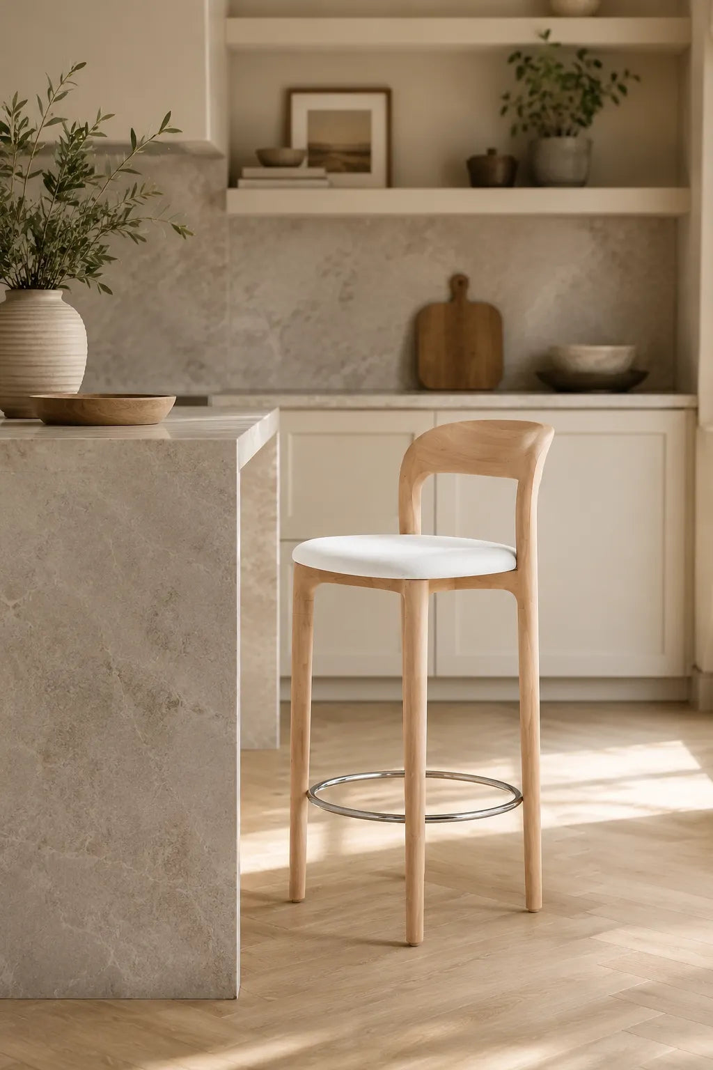 Mid-Century Southwood bar stool with oak-colour ash wood frame, white upholstered seat and chrome footrest in three-quarter studio view