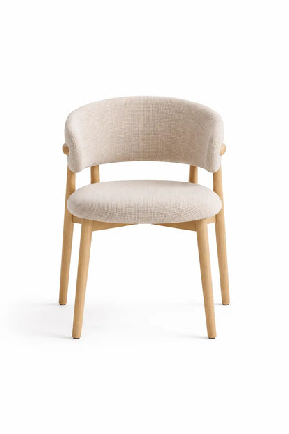 Richmond upholstered dining chair styled in a modern dining room with wooden table and neutral interior