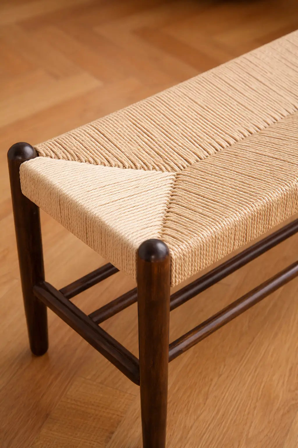 Close-up of handwoven Danish cord seat on Finsbury Scandinavian wooden bench.