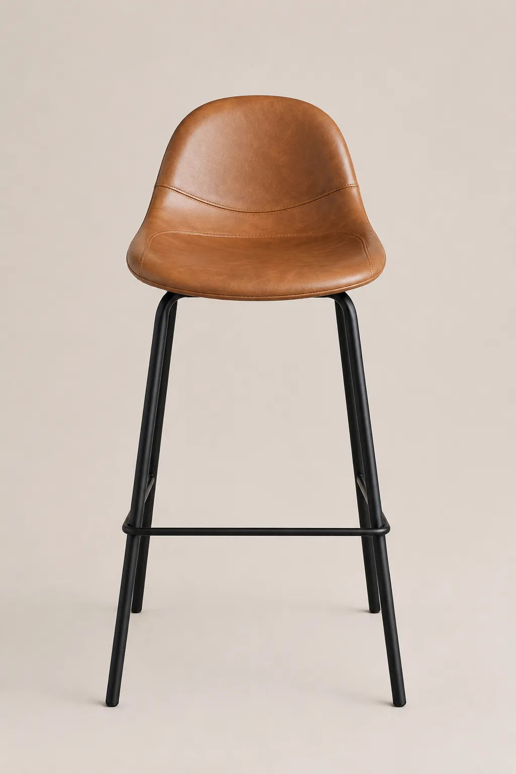 Brown leather bar stool with black metal legs on a beige background