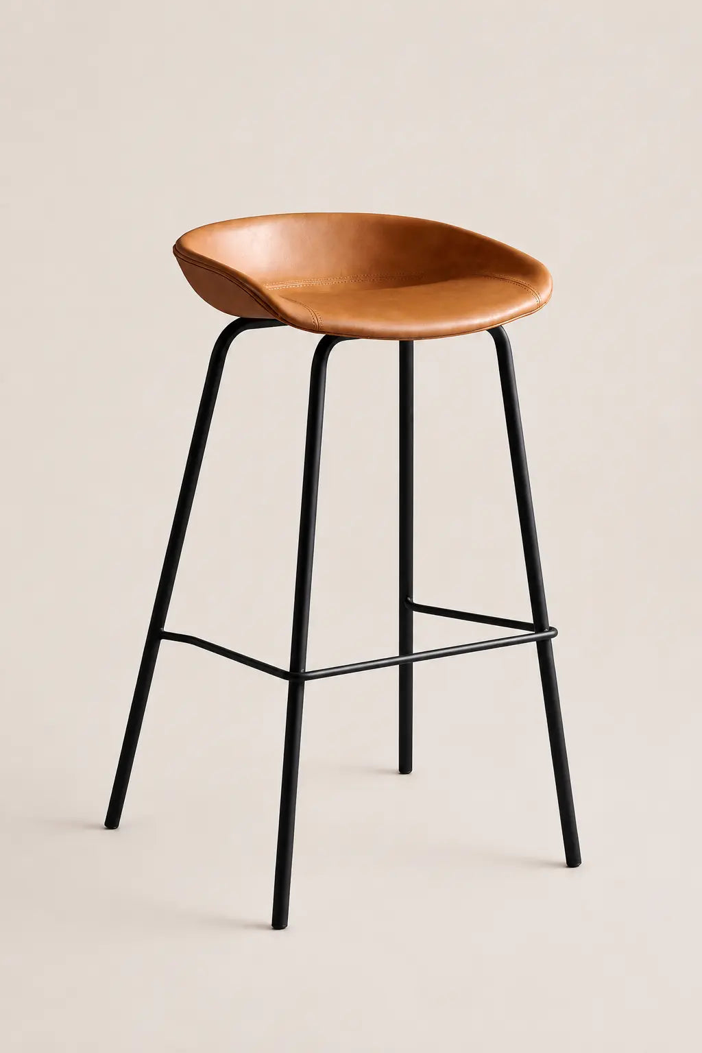 Black metal bar stool with tan faux leather seat for modern kitchen island and breakfast bar