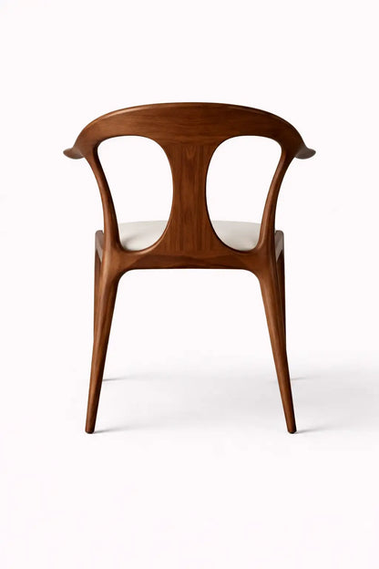 Back view of sculptural walnut dining chair with open backrest design, modern architectural dining chair UK.