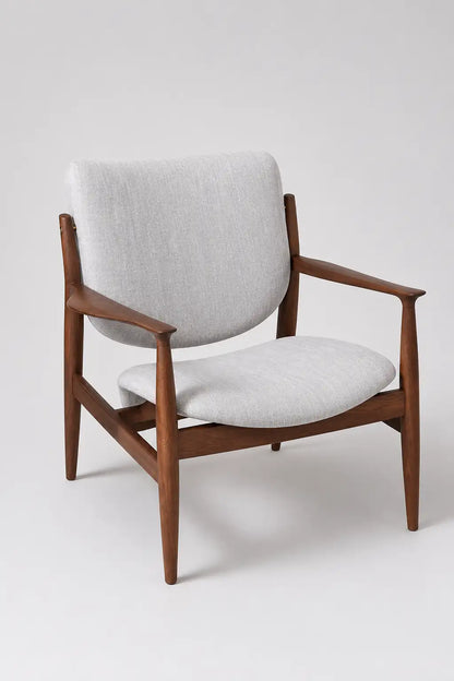 Front view of a mid-century upholstered lounge chair with walnut frame, curved seat and supportive backrest