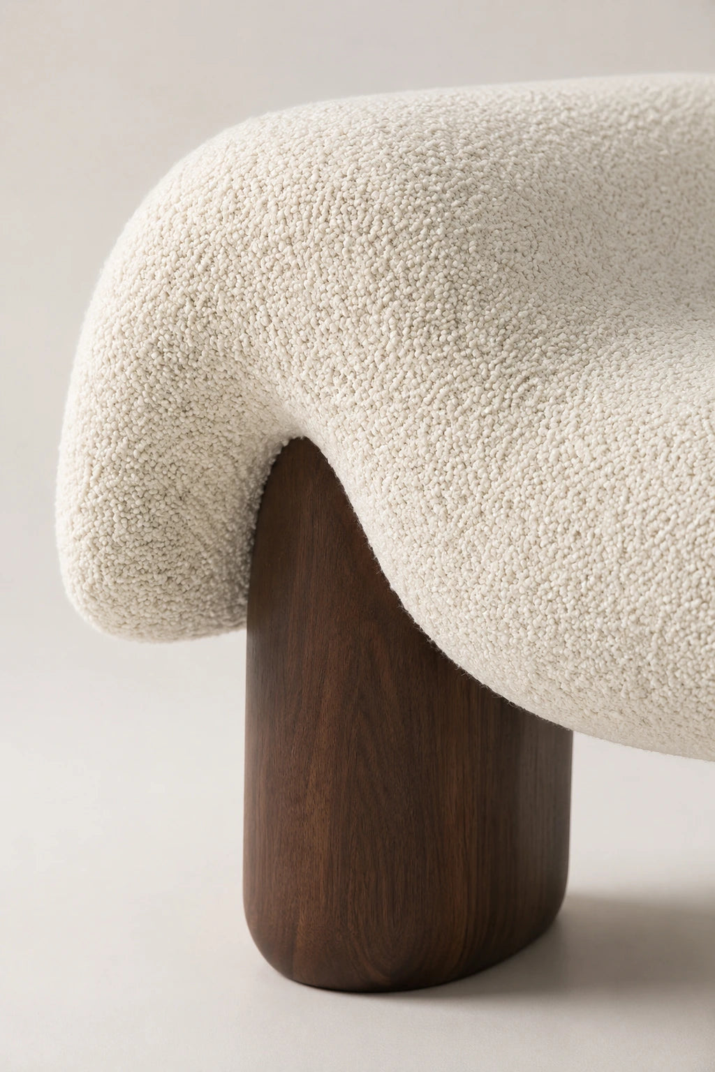 Close-up of Haven white bouclé bench seat showing textured upholstery and sculptural curved form